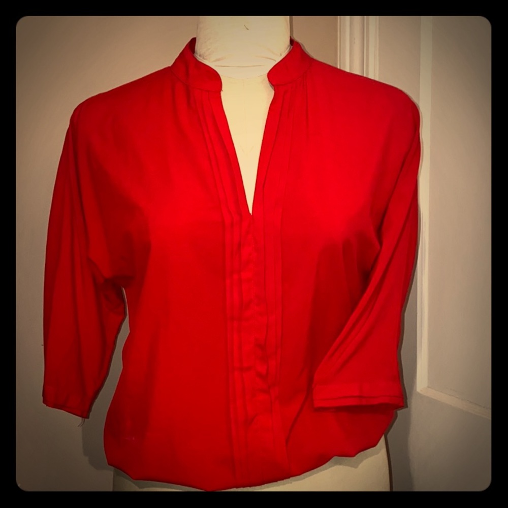 Bright pink blouse with pleated front